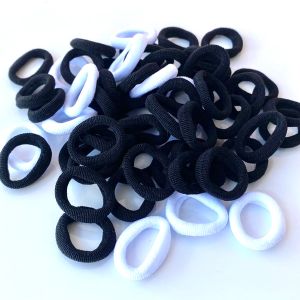 Coleteros pequeños sin marca
Mini cauchos pelo blanco y negro - Pack 50 coleteros pequeños protección cabello