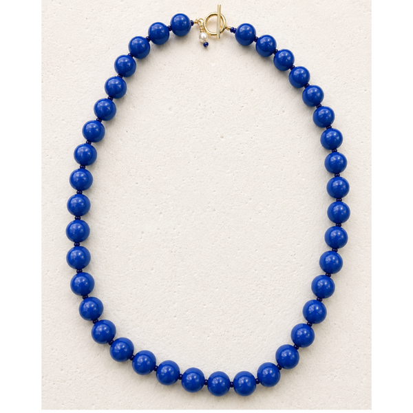 Collar pelpas azules con cierre dorado en T y dije de perla de agua