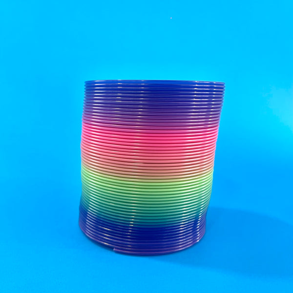 Juguete clásico resorte muelle arcoíris colores vibrantes fidget sensorial