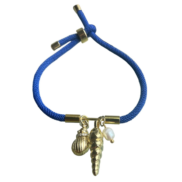 Pulsera ajustable en cordón azul con dijes de concha y perla de agua