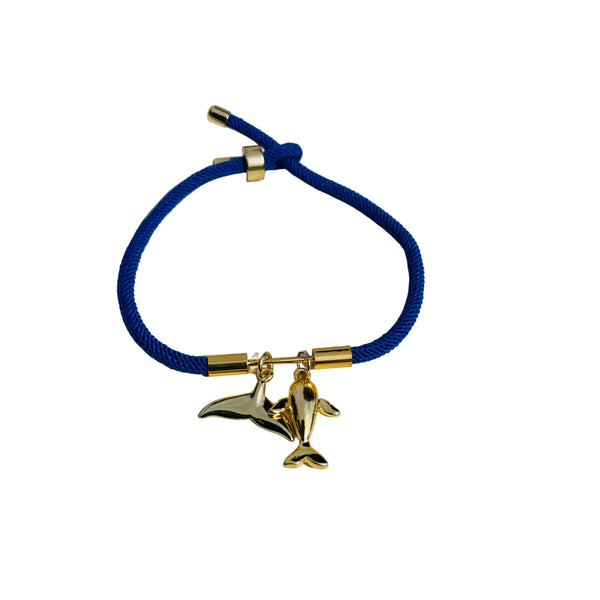 Pulsera cordón azul con dije ballena completa y cola de ballena en rodio, ajustable hipoalergénica diseño marino MariaBolo Colombia