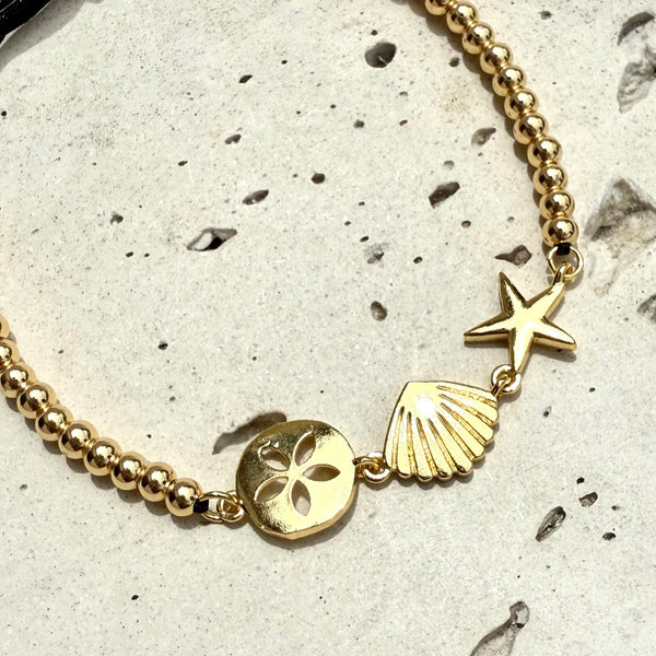 pulsera en hilo con dijes marinosen rodio