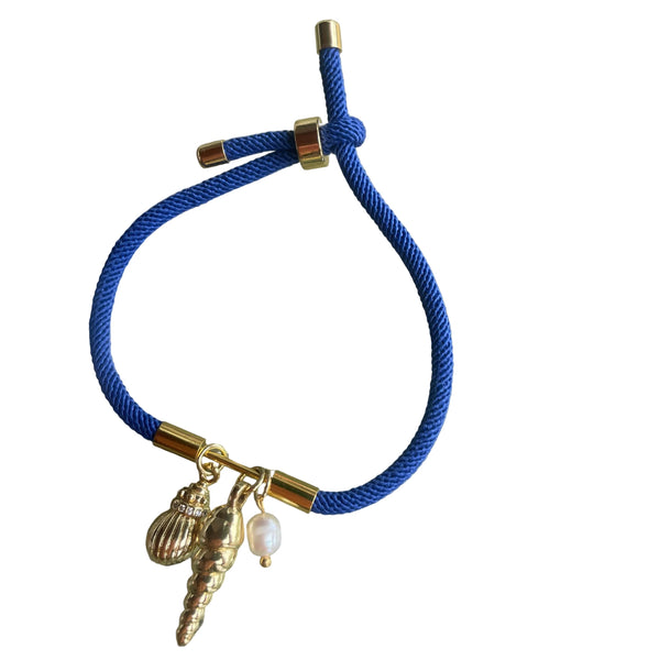 Pulsera de cordón azul con dijes de mar en rodio  