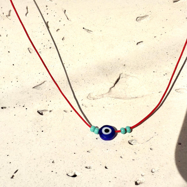 Cadena Good Vibes hecha a mano hilo rojo dije ojo turco amuleto protección artesanal MariaBolo